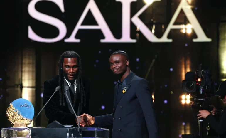 2026: Ballon d’Or: Burna Boy presents Socrates Award to Bukayo Saka